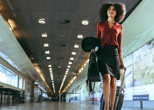 Businesswoman walking towards boarding gate