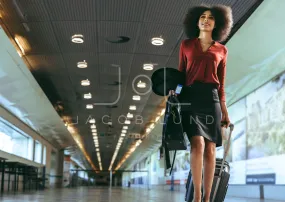 Businesswoman walking towards boarding gate